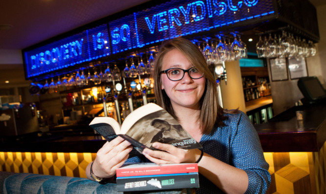 Mariel Symeonidou reads in the South Tay Superstore pub in Dundee.