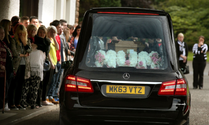 A hearse carrying the coffin of Lamara Bell arrives at Falkirk Crematorium for her funeral.