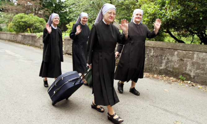 Sisters Catherine Mary, Joseph, Mary Christine and Veronica finish work and are ready to leave.