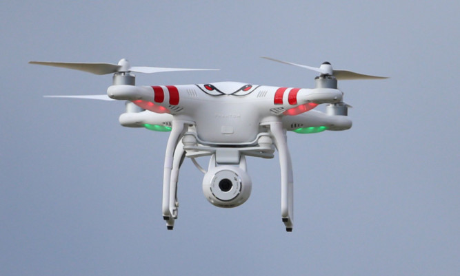 A stand alone picture of a quadcopter type drone with a camera in Belfast today.  PRESS ASSOCIATION Photo. Picture date: Friday May 9, 2014. See PA story STAND ALONE  Drones . Photo credit should read: Niall Carson/PA Wire