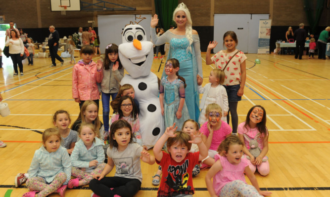 Olaf and Elsa with children at the family fun day for the Blake McMillan Trust.