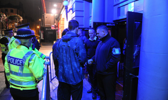 Police and door staff at Beau Nightclub. Officers work closely with pubs and clubs across Dundee, sharing information to help make the city a safer place to have a fun night out.