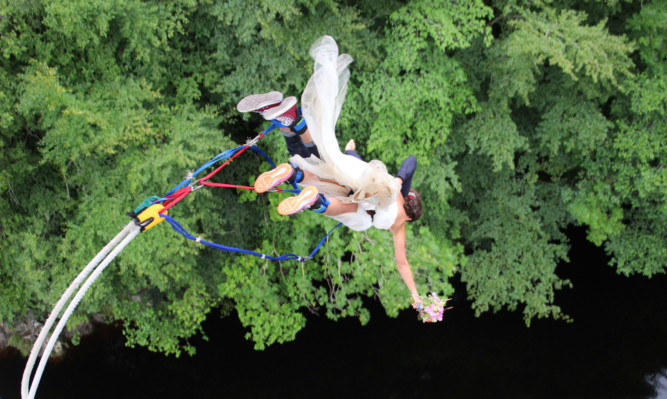 Ross Basham and Hannah Phillips jump-started married life by holding their wedding on a bungee jump platform and then leapt 40 metres on the same cord at Garry Bridge near Killiecrankie in Perthshire.