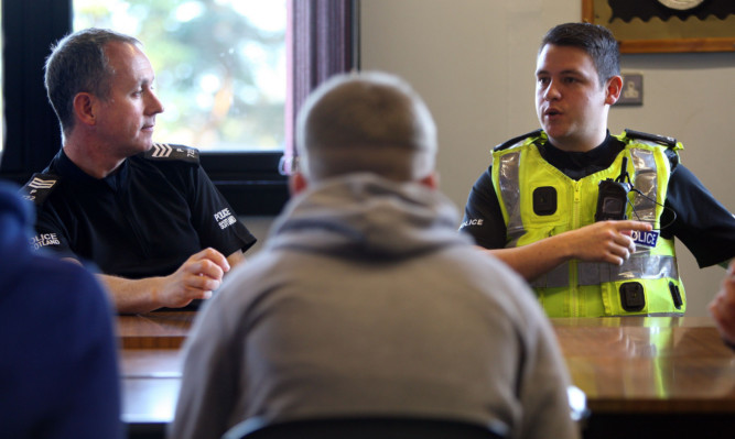 Sgt Neill and PC Duncan speaking to pupils at Kirkcaldy High School.