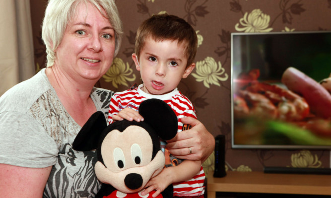 Oliver Bosch back home from hospital with his mum, Jemma.