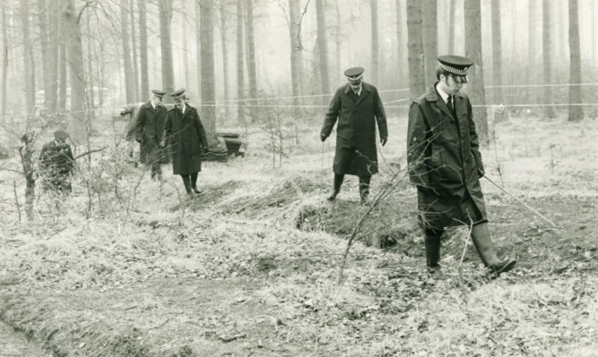 Police search Templeton Woods in 1980 following the discoveries of the bodies of Carol Lannen and Elizabeth McCabe.