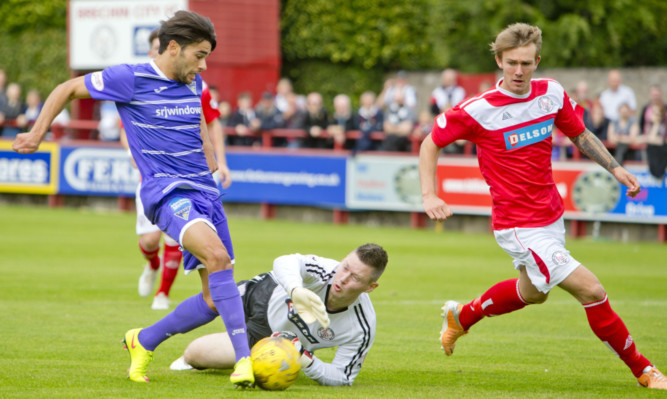 Faissal El-Bakhtaoui pounces to give Dunfermline the lead after City goalkeeper Graeme Smith saved his first effort.