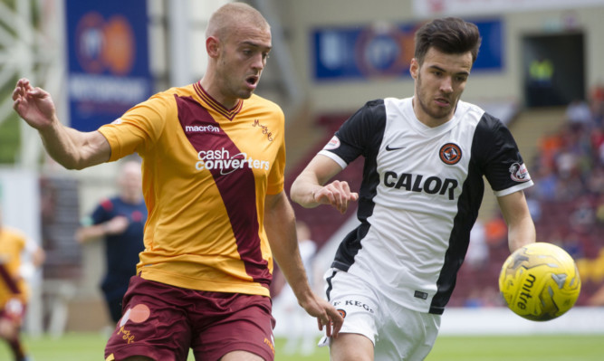 Scott Fraser (right) battles with Motherwell's Louis Laing.