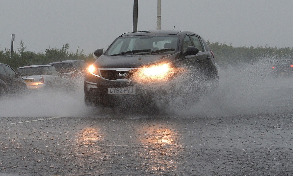 A car makes its way through heavy rain on Brighton seafront, as torrential downpours and thunderstorms swept in from the South, bringing the risk of flooding as some areas may receive as much as a month's average rainfall over the next 36 hours. PRESS ASSOCIATION Photo. Picture date: Thursday August 13, 2015. MeteoGroup has said rainfall totals in England and Wales are expected to be between 30 and 50mm today and Friday, with the risk of intense thundery downpours. Average August rainfall in central and eastern England is only about 50mm. See PA story WEATHER Floods. Photo credit should read: John Stillwell/PA Wire