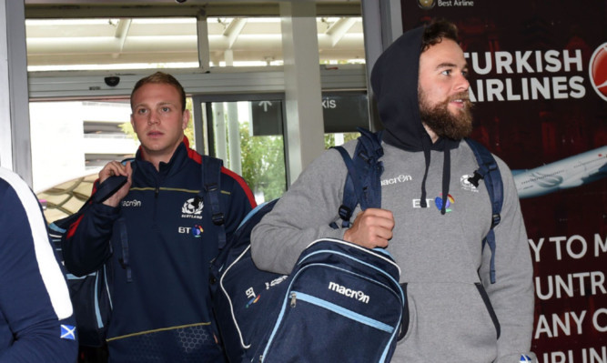 Ruaridh Jackson (right) and fly half rival Greig Tonks leave for Dublin with the Scotland team yesterday.