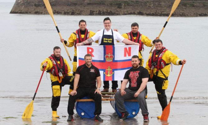 Chef Jamie Scott, holding the flag, joined by, back, from left, Liam Murray, Andy Spink, Jamie Robertson and Peter Tyler, and, front, Lee Page, left, and Nick Whitecross.