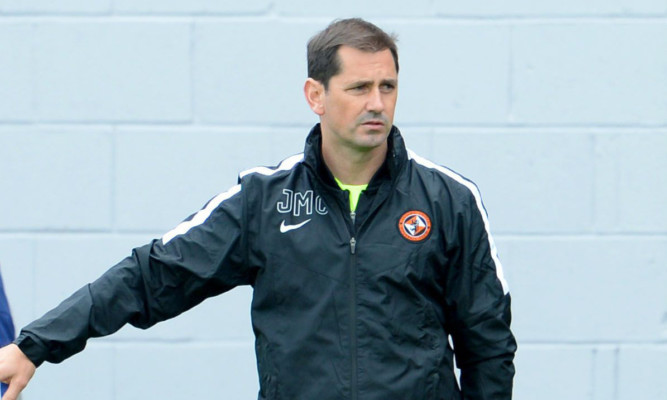 Jackie McNamara watches his side lose heavily at Hamilton.