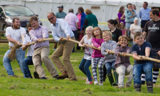 Giving it their all in the tug-o'-war.