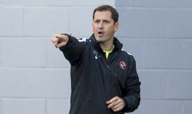 Dundee United manager Jackie McNamara watches his team lose to Hamilton.