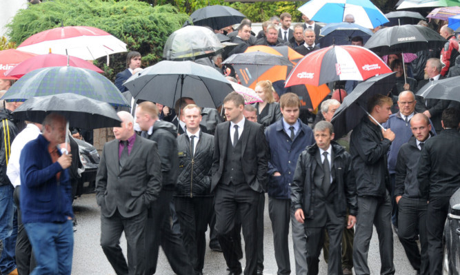 Some of the mourners at the service in Arbroath.