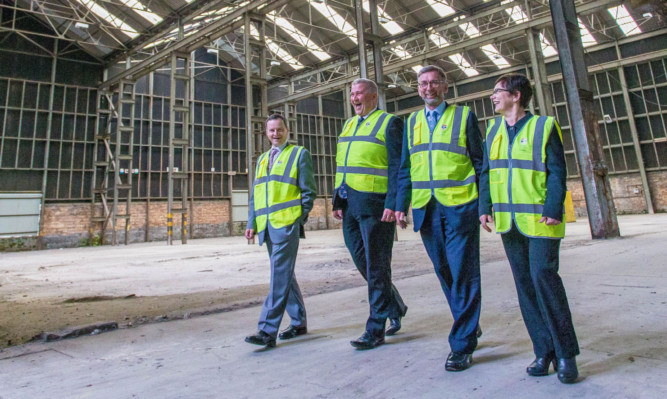 Lord Dunlop, second right, visits the site for the new biomass facility at Guardbridge, accompanied by senior St Andrews University staff, from left, Alastair Merrill, Derek Watson (chief operating officer) and Professor Verity Brown.