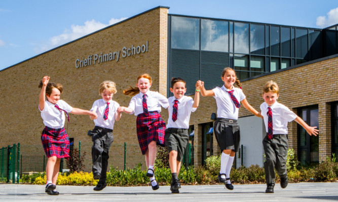 Excited P4 pupils Erin Lowe, Curtis McAllister, Sophie Malcolm, Bradley Harvey, Sophie Hordon and Finlay Brock on the school's first day.