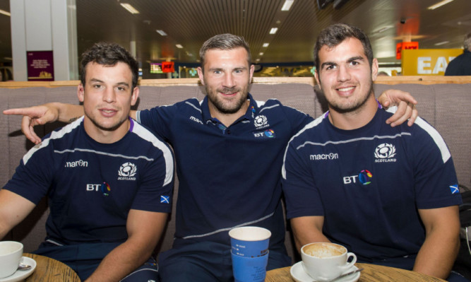 Rory Hughes (centre) with fellow new caps John Hardie (left) and Stuart McInally.