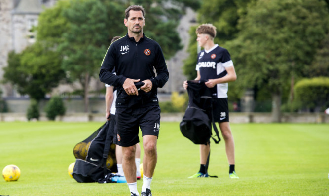 Jackie McNamara watches over training.