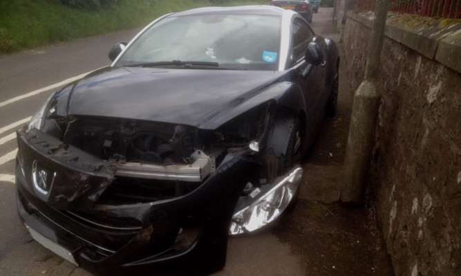 The car and van collided in the notorious stretch of road through the village.