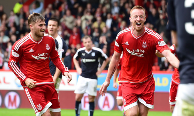 Adam Rooney (right) celebrates his opening goal.