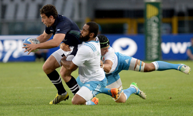 Scotland's John Hardie, left, is challenged by Italy's Samuel Vunisa.