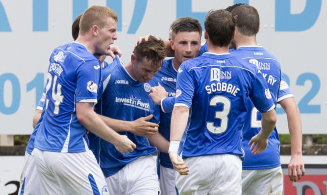 Steven MacLean (centre) is mobbed by his team-mates after scoring what proved to be the winner.
