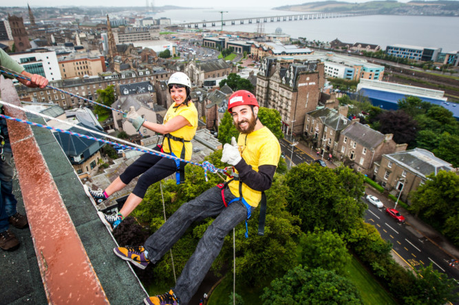A group of six intrepid people abseiled down Dundee Universitys tower building to raise money for the ARCHIE foundation at the weekend. Two members of the foundation accompanied four nurses in completing the feat to help to raise money to build a new operating theatre for children at Ninewells.  Photo shows Suzanne Scott and AJ McMenemy taking the plunge.