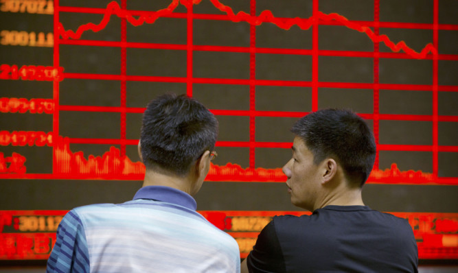 Chinese investors monitor prices as the country's main stock market index fell for a third day.