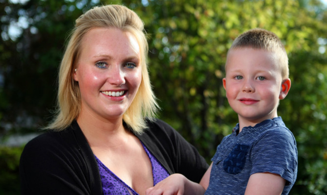 Home safely: Sophie and her son Alfie were among those who had to leave the centre.