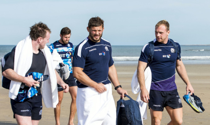 Ross Ford (centre) with Stuart Hogg and Greig Tonks after their recovery session in the sea on the West Sands at St Andrews.