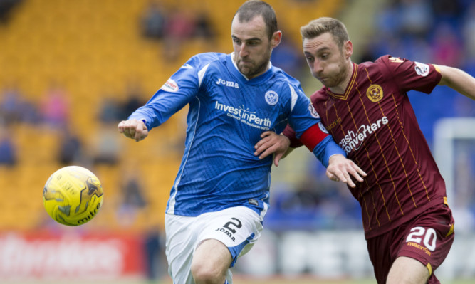 Dave MacKay battles for the ball with Motherwell's Louis Moult.