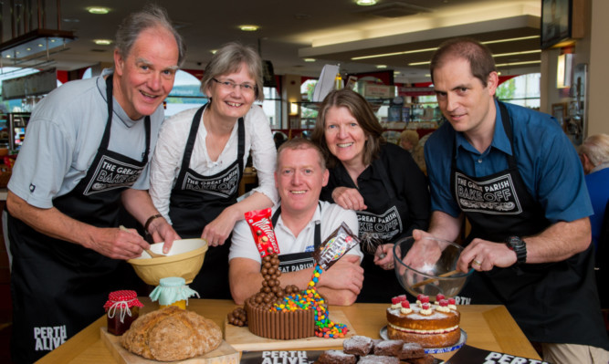 Preparing for the bake off are, from left, committee members James Gill, Jane Milne, judge Colin Laing, Kathleen Crawford and John Banks.