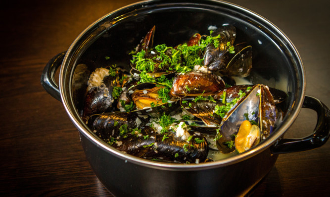 Steamed mussels with white wine and shallots.
