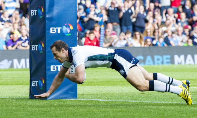 Tim Visser scores his second and Scotland's fifth try in their rout of Italy.