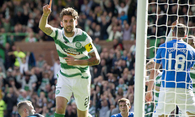 Alan Mannus is on the deck as Charlie Mulgrew scores Celtic's third.