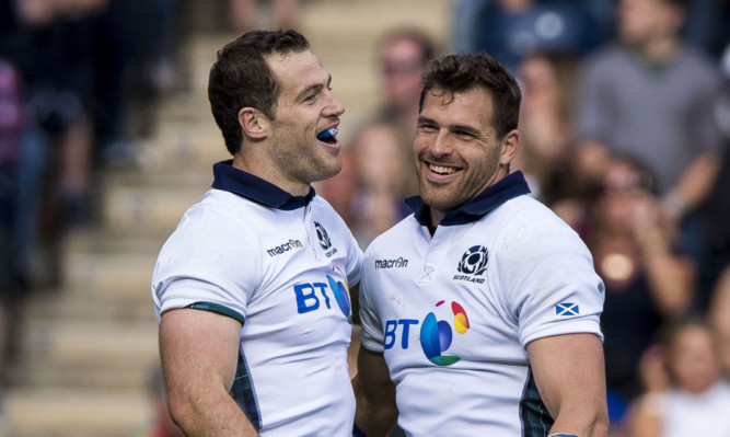 Tim Visser (left) and Sean lamont celebrate their try doubles against Italy on Saturday.