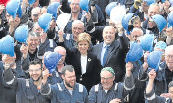 First Minister Nicola Sturgeon on a visit to Ferguson Marine Engineering with owner Jim McColl, centre right.