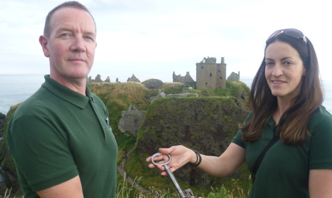 Wendy Sylvester hands over the key for Dunnottar Castle to incoming custodian Jim Wands.