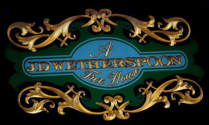 JD Wetherspoon logo outside The Lord Burton pub in Burton on Trent, Staffordshire. PRESS ASSOCIATION Photo. Picture date: Friday March 15, 2013. See PA story CONSUMER  JD Wetherspoon. Photo credit should read: Rui Vieira/PA Wire