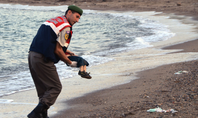 Photos of a boy's body being washed up on a Turkish beach have prompted a huge demand for action.