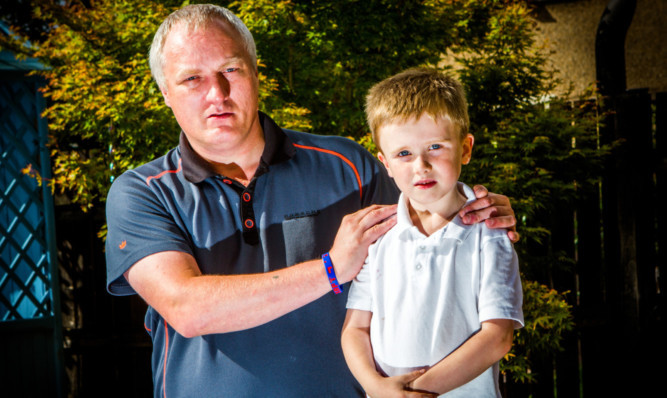 Xander with his dad.