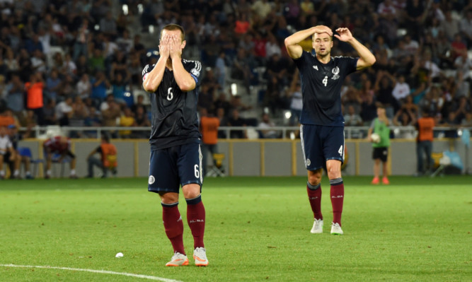 Dejection for Scotland duo Shaun Maloney, left, and Russell Martin as the final whistle confirms a 1-0 defeat by Georgia.