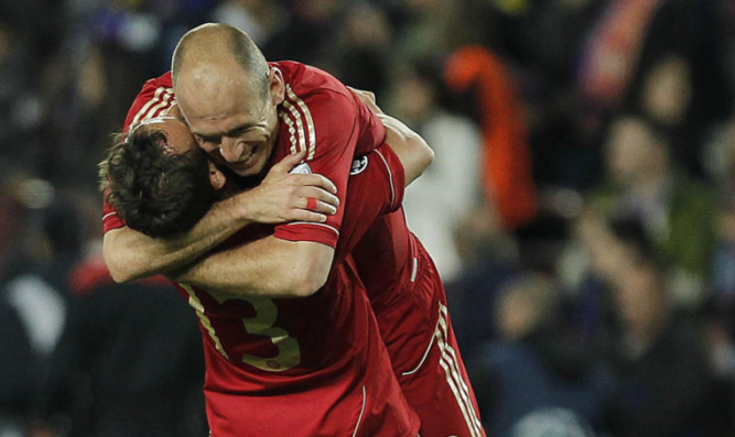 Bayern's Rafinha and Arjen Robben celebrate after winning the Champions League semi-final.