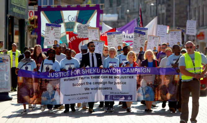 Hundreds joined the march, led by Sheku's family and their lawyer Aamer Anwar.