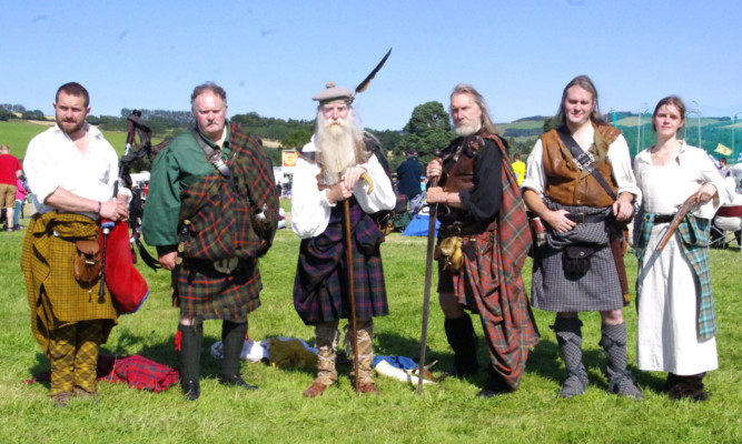 Some of the Ardblair Highlanders who gave demonstrations of how the kilt and plaid should be worn, from left: Ross McNaughton, Bernard Noonan, Laurence Blair Oliphant, John Neilson and Greig and Karolina McKenzie-Milne.