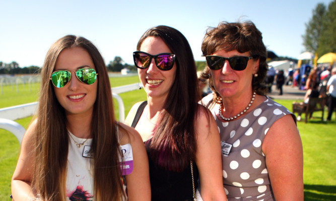 Jill and Beth with mum Patti Smith, from Arbroath, enjoying the the warm sunshine at Perth Racecourse on Monday.