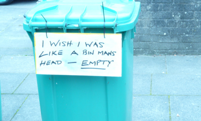 A cheeky resident has had a go at the council bin men who failed to collect his bin.