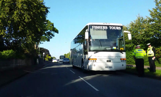 The Fishers Tours coach was stopped by police.