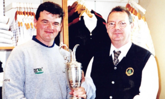 Mr Roy with the winner of the 1999 Open held at Carnoustie, Paul Lawrie.